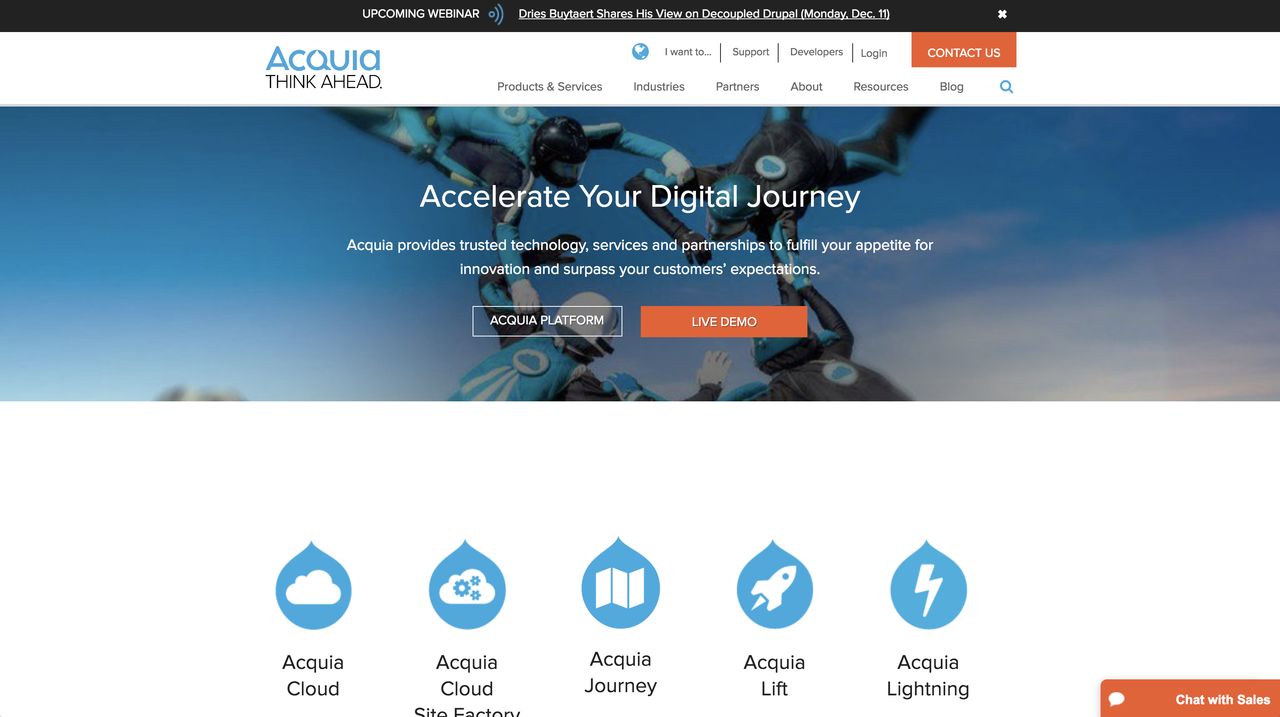 Acquia website homepage with a banner of skydivers and buttons for Acquia Platform and Live Demo.