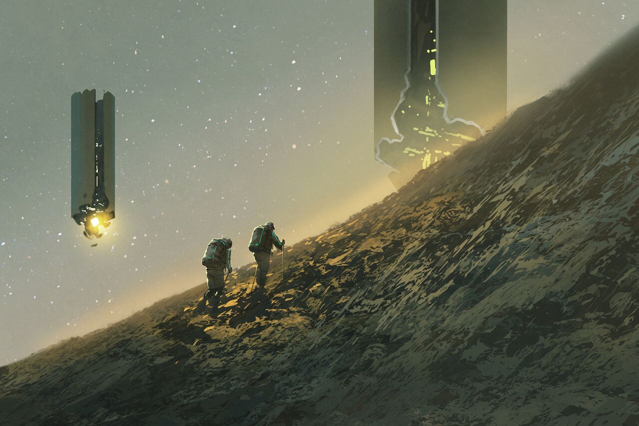 Two climbers make their way up a rocky hillside together under a starry sky, heading toward a distant glow on the horizon.