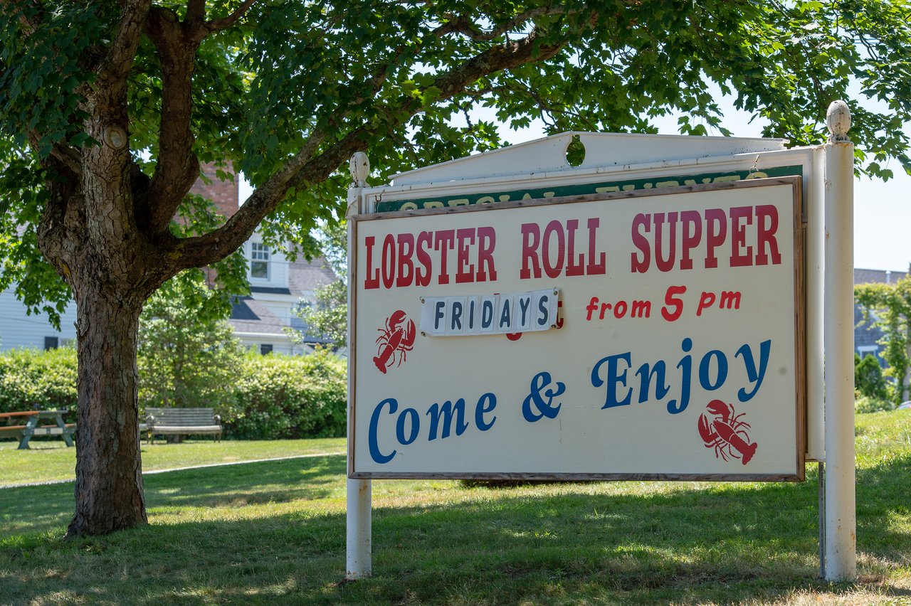 A sign advertises a lobster roll supper on Fridays at 5pm.