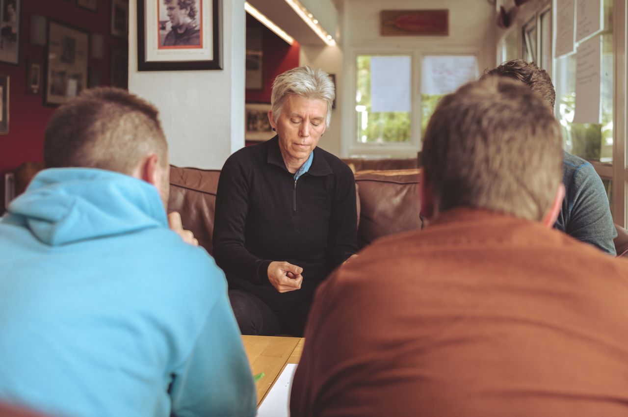 Four people participating in a group discussion.