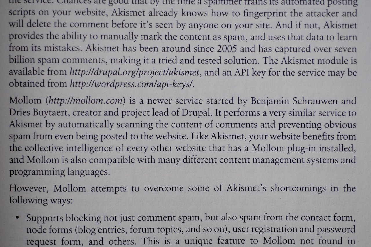 A page from an O'Reilly book about using Drupal, discussing spam filtering with Akismet and Mollom services.