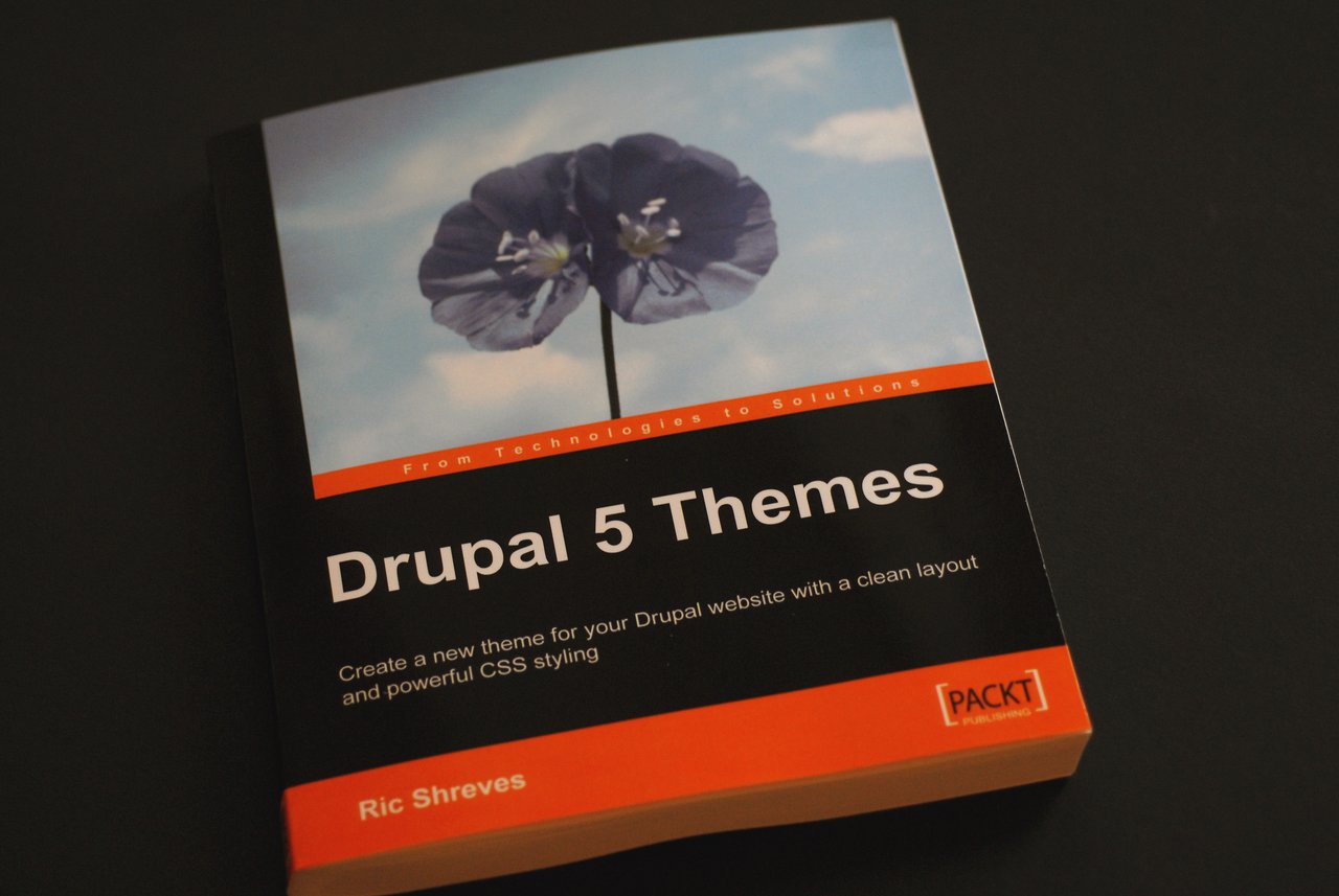 A book titled "Drupal 5 Themes" by Ric Shreves, published by Packt, placed on a dark surface.