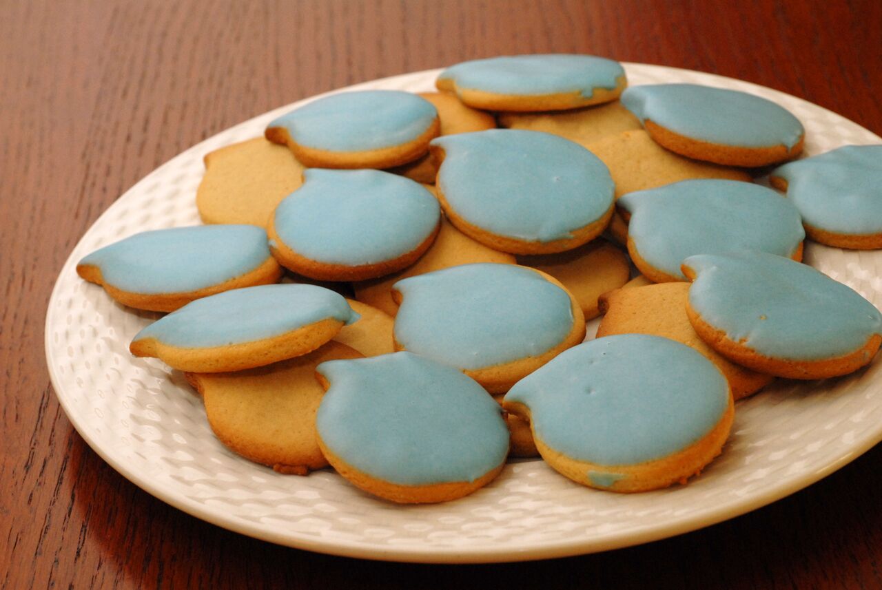 A plate of homemade cookies with blue icing, shaped like the Drupal logo, celebrating Drupal's birthday.
