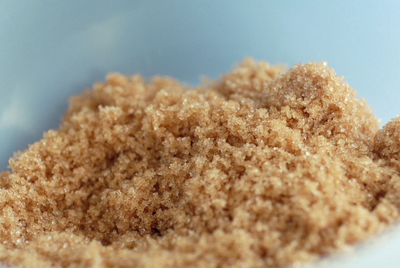 A bowl filled with brown sugar, ready to be used as an ingredient for baking cookies.