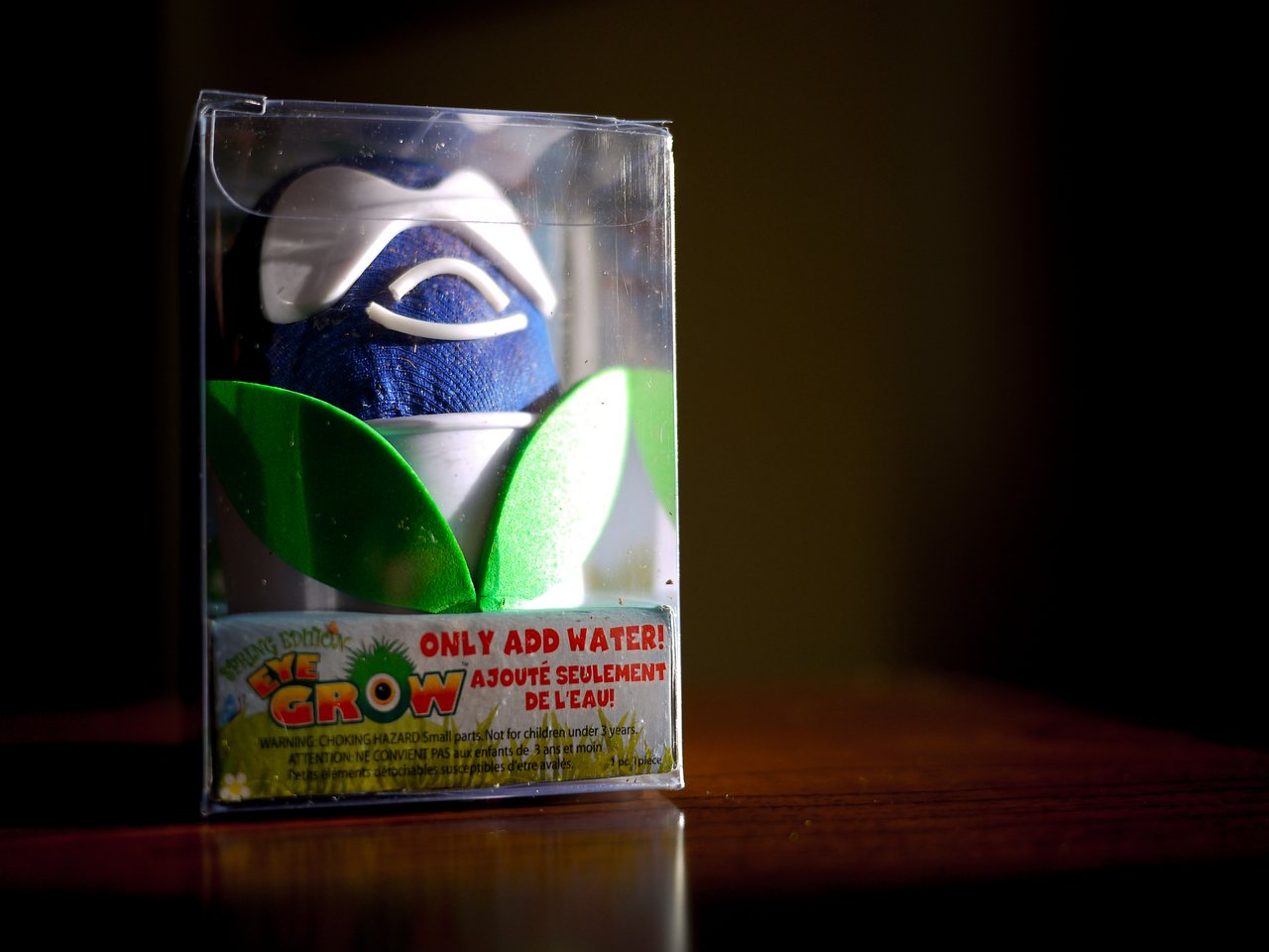 A small toy resembling a blue creature with leaves is inside clear packaging labeled "Only Add Water!.