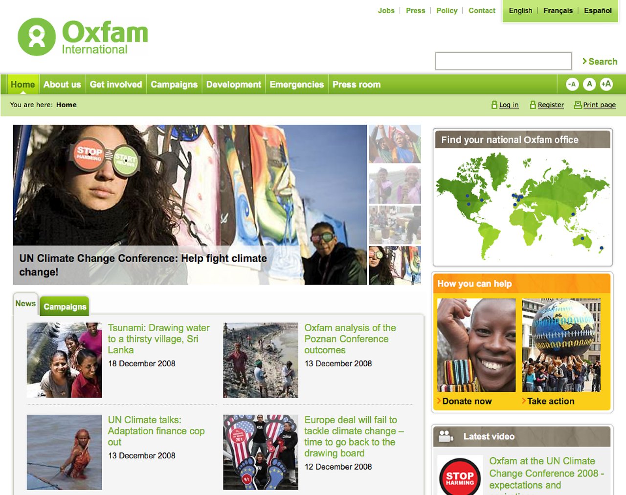 A woman wears goggles with "Stop" and "Start" messages at a climate conference, promoting action against global warming.