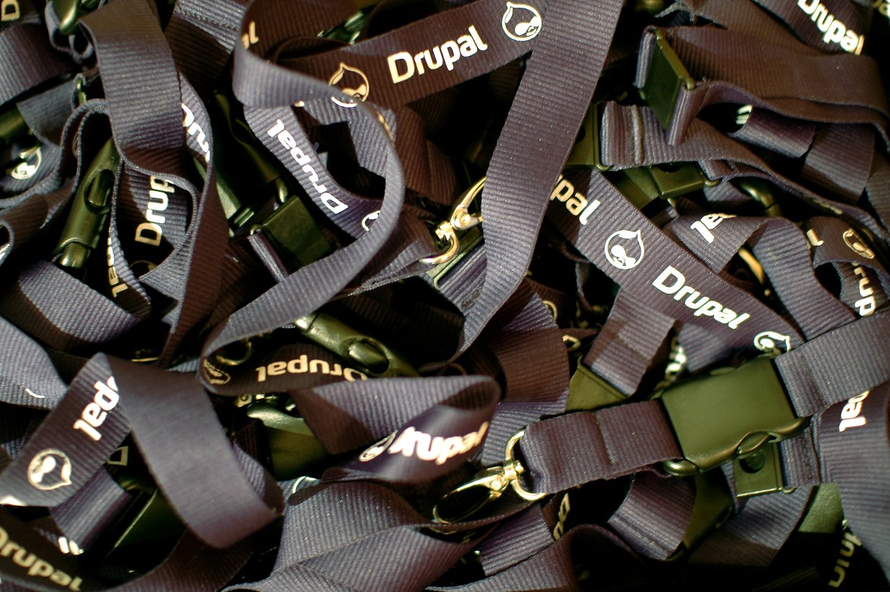 A pile of black Drupal-branded lanyards with clips, likely event swag from DrupalCon Brussels 2006.