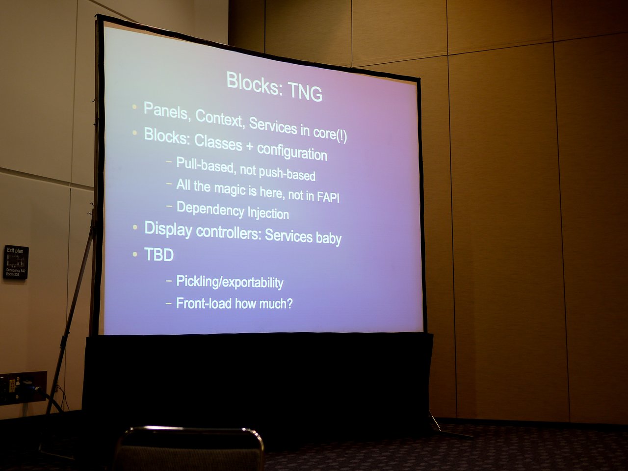 A presentation slide titled "Blocks: TNG" discusses panels, context, services, block configuration, dependency injection, and display controllers.