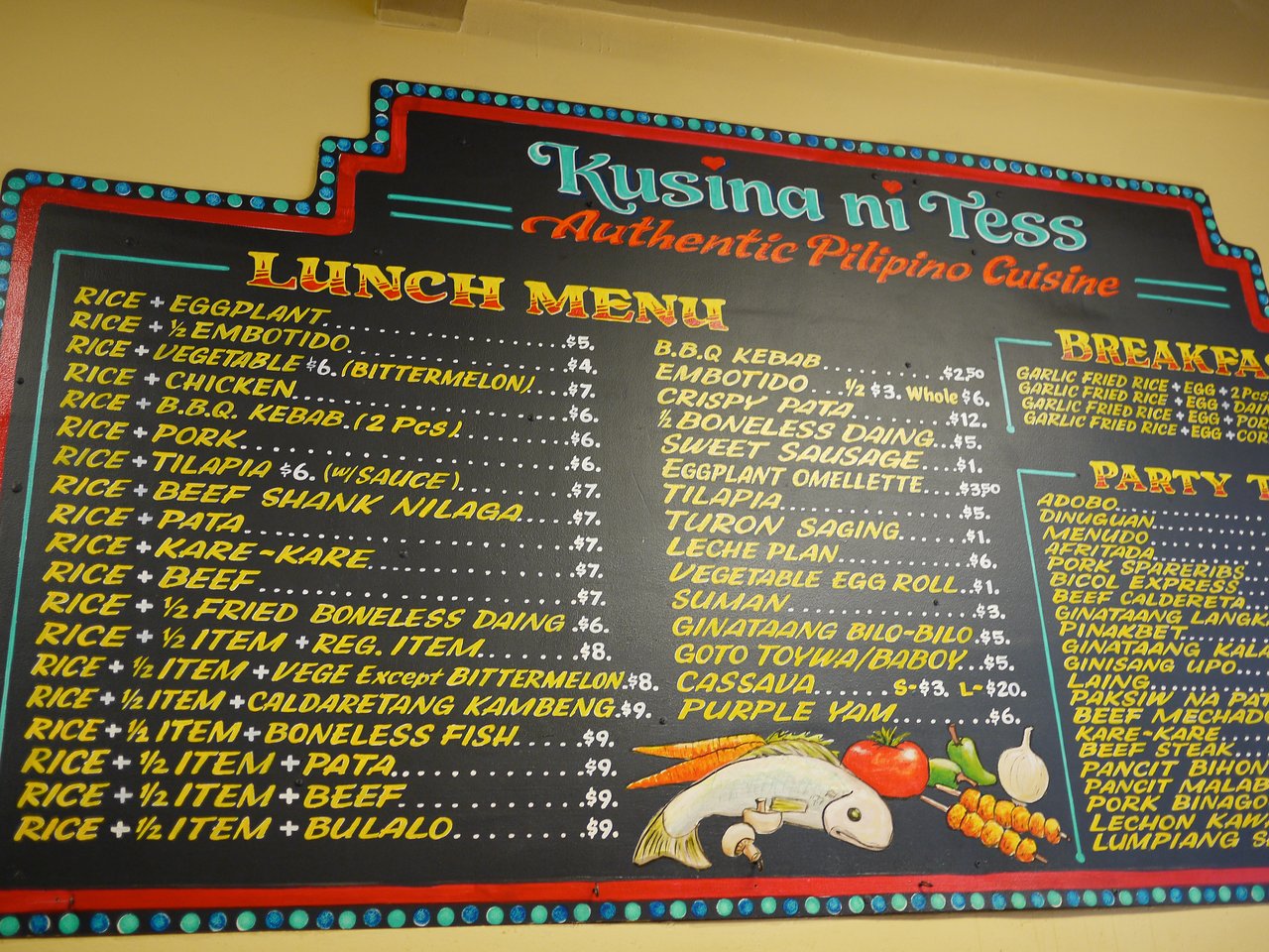 A restaurant menu board displays various Filipino dishes, including breakfast options with garlic fried rice, eggs, and meats.