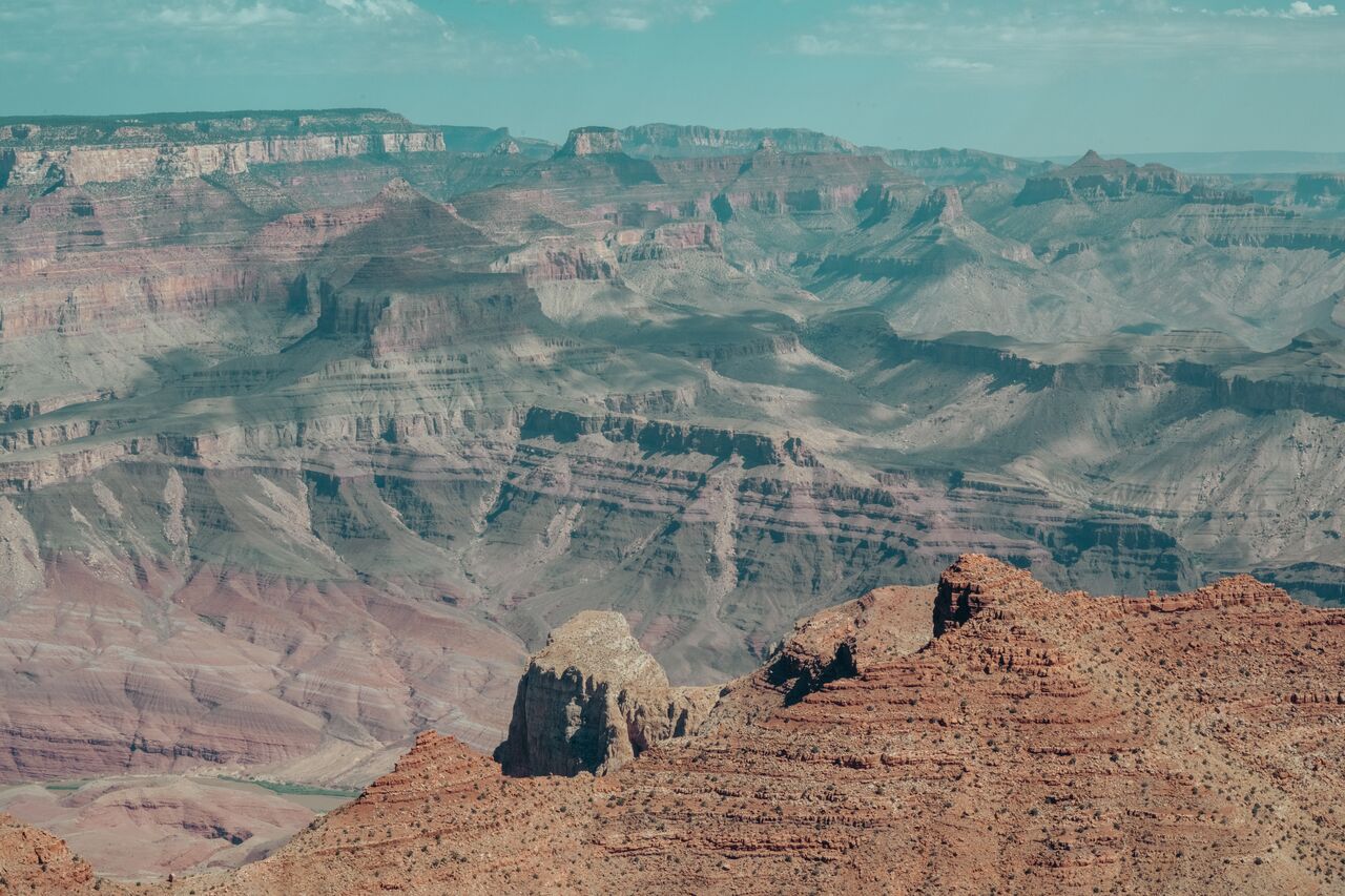 Grand Canyon view from Navajo Point showing layered red rock formations and deep canyon walls.