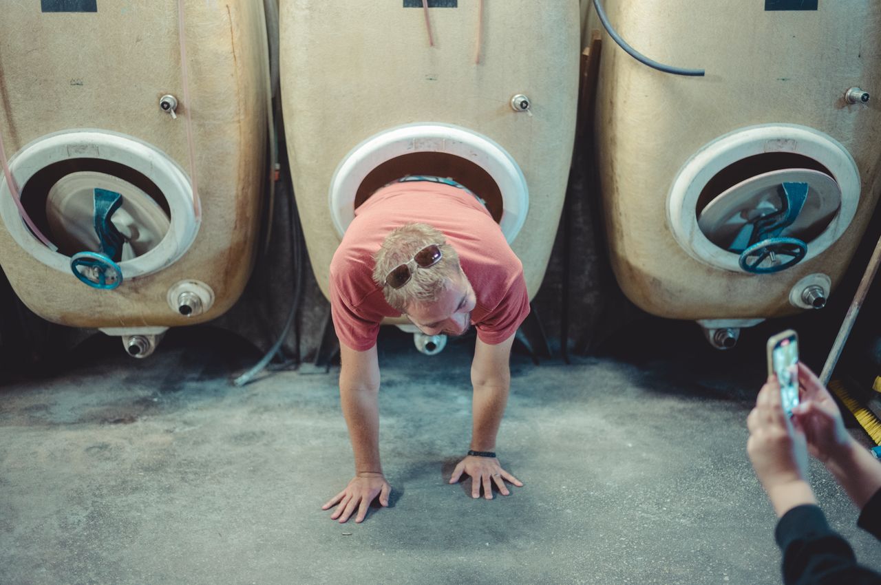 Climbing out of wine vat
