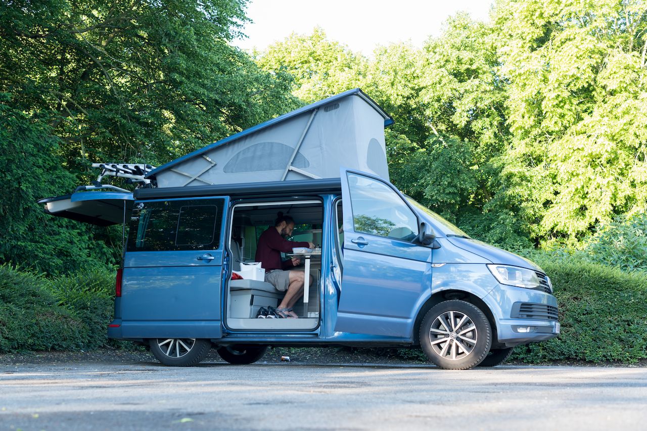 Klaas making breakfast in his Volkswagen California