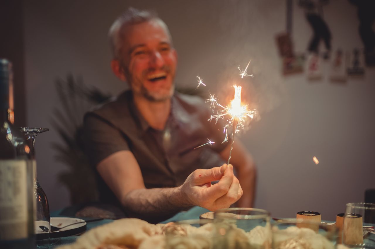 Ben holding multiple sparklers wrapped together.