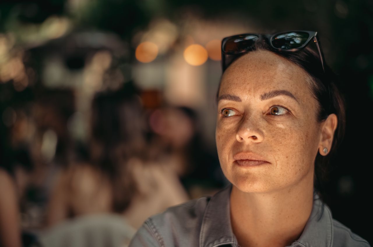 A close-up portrait of Vanessa with a warm mood.