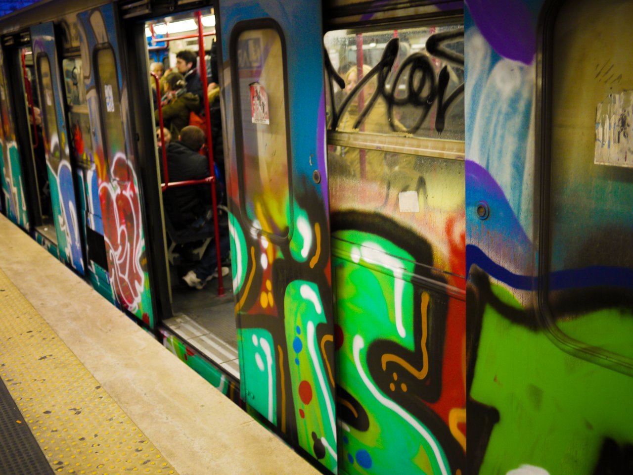 A metro covered in graffiti.