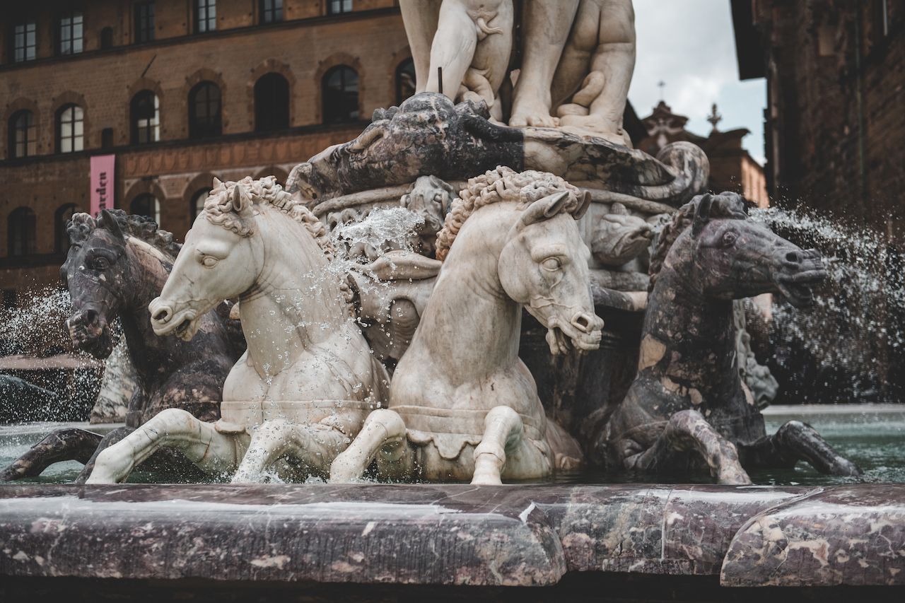 Close-up of a fountain with detailed horse sculptures.