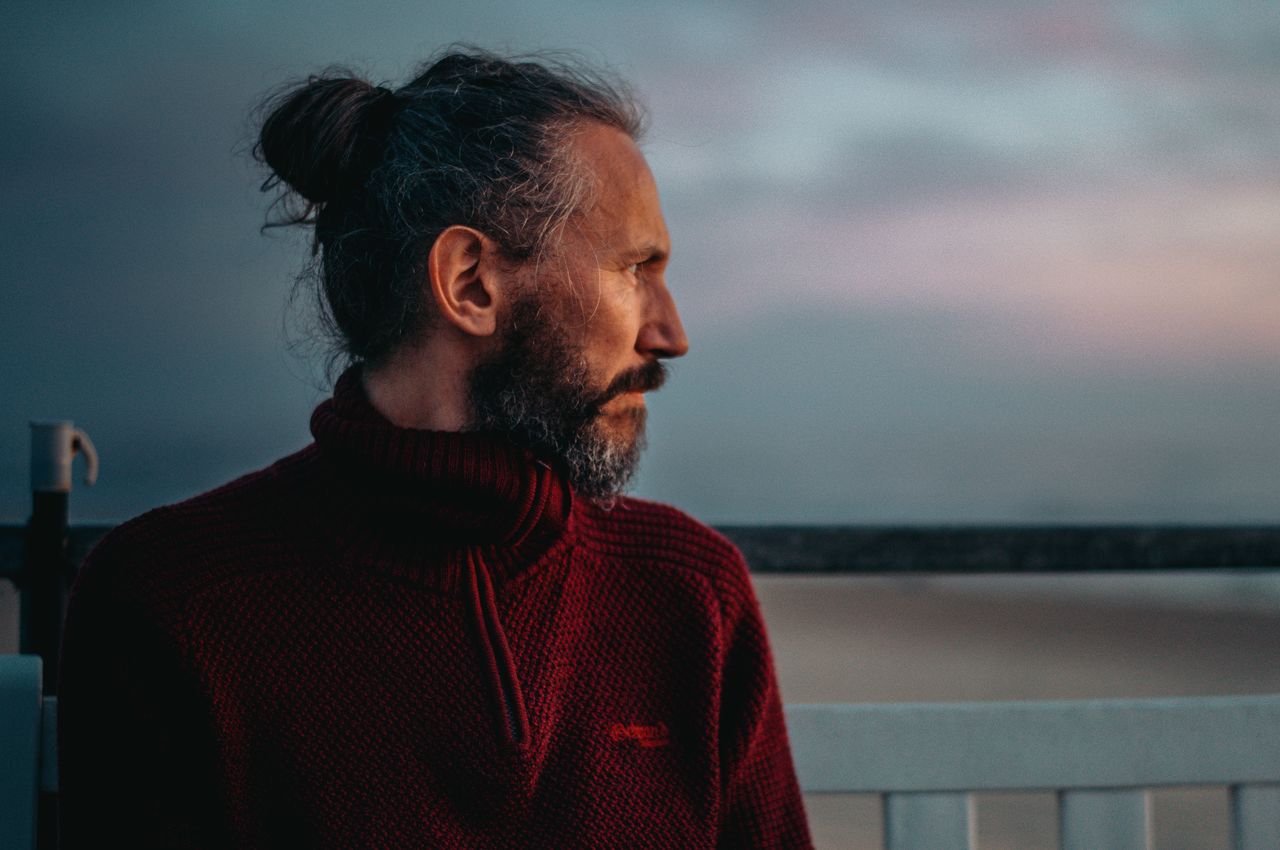 A portrait of a man with the sunset illuminating his face.
