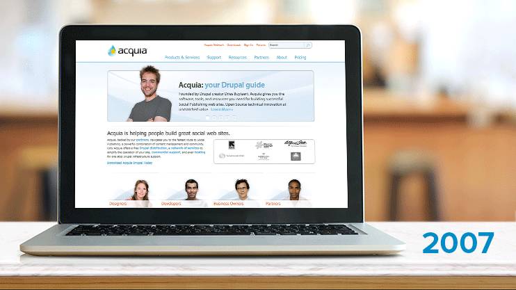 A laptop screen shows Acquia's website evolution from 2007 to 2017, highlighting design and content updates over time.