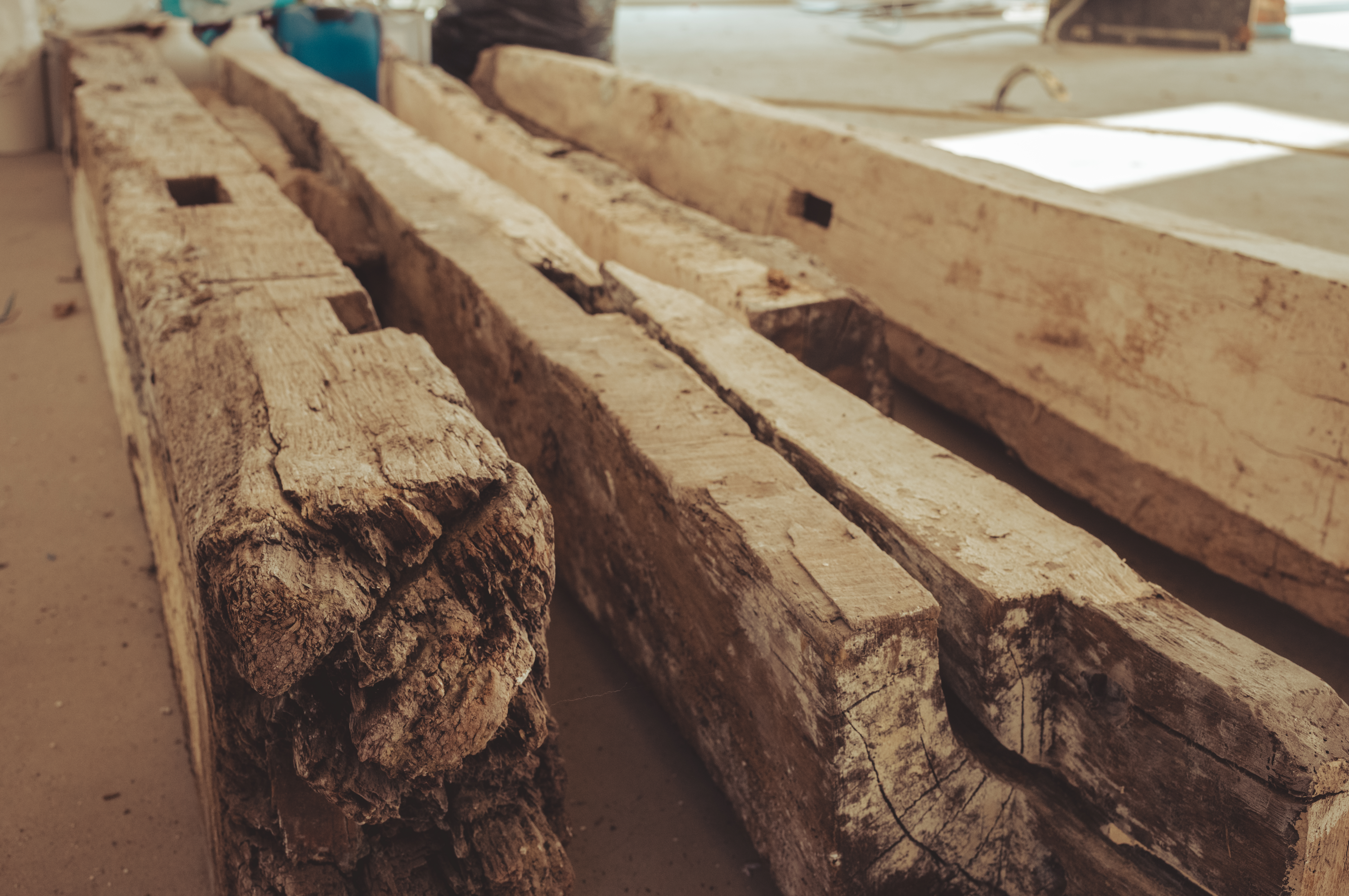 Some old beams are on the floor. They were part of the original barn.