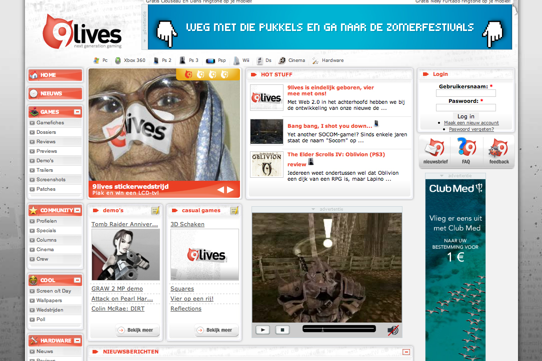 A gaming website homepage featuring news, reviews, and a contest with a "9lives" sticker on a person's face.