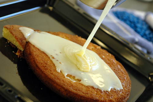 Frosting being applied on a cake