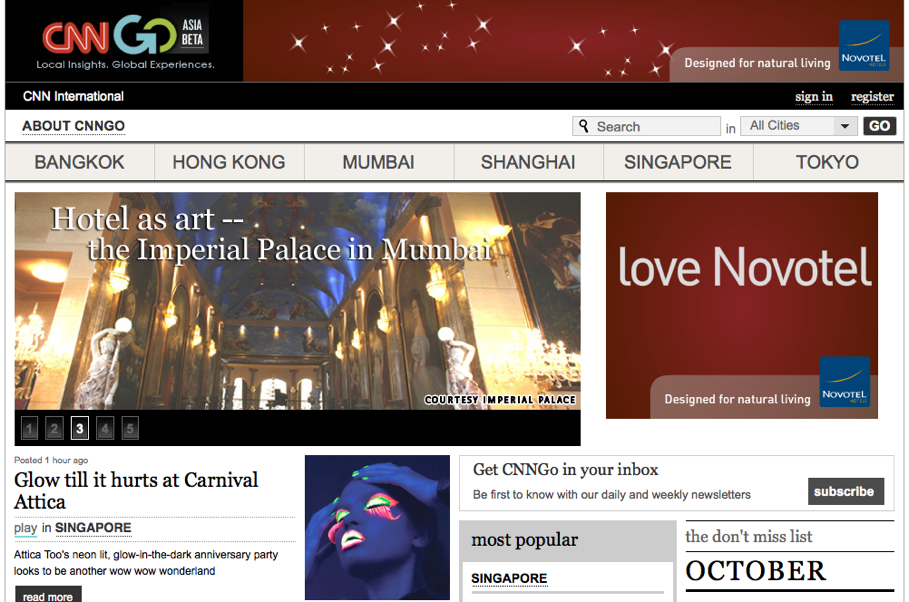 CNNGo website homepage featuring travel articles, a highlighted hotel in Mumbai, and an advertisement for Novotel.