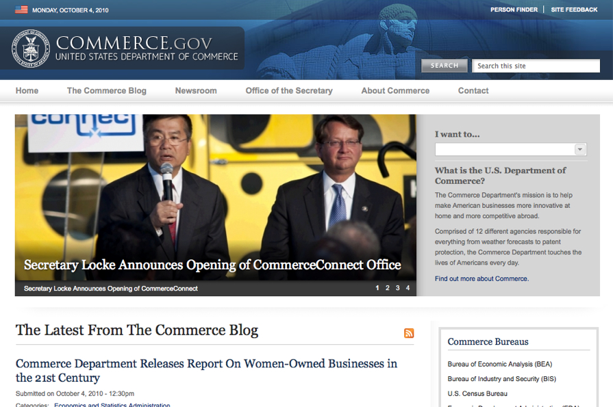 Secretary Locke speaks at an event announcing the opening of the CommerceConnect office, with another official standing beside him.