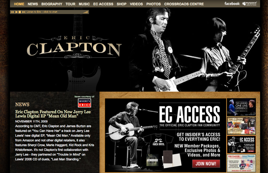 A website featuring Eric Clapton with a black-and-white image of him playing guitar and news about his music.