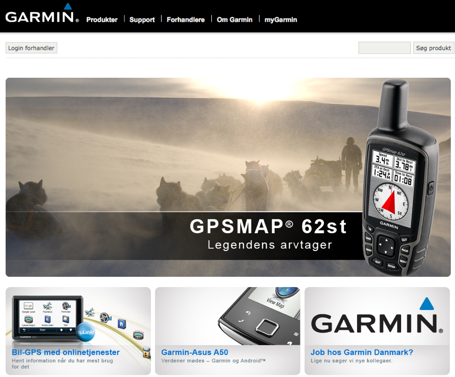 A Garmin GPS device is displayed over an image of a dog sled team moving through a snowy landscape.