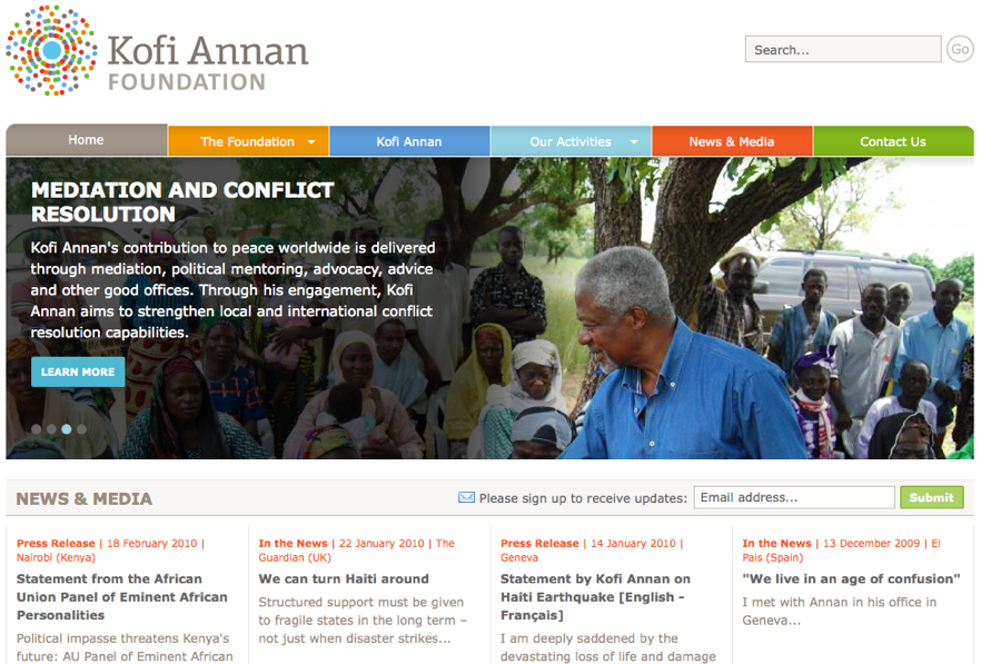 Kofi Annan speaks with a group of people outdoors, promoting mediation and conflict resolution through his foundation.