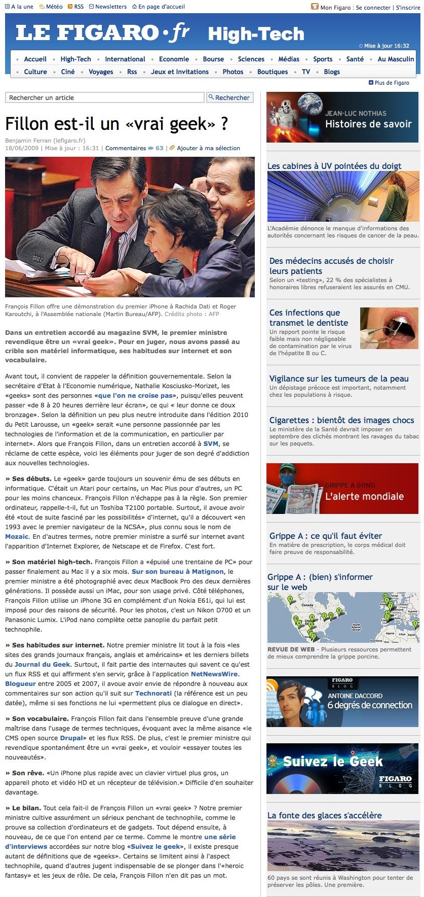 A man in a suit shows his smartphone to two colleagues, who lean in closely to see the screen.