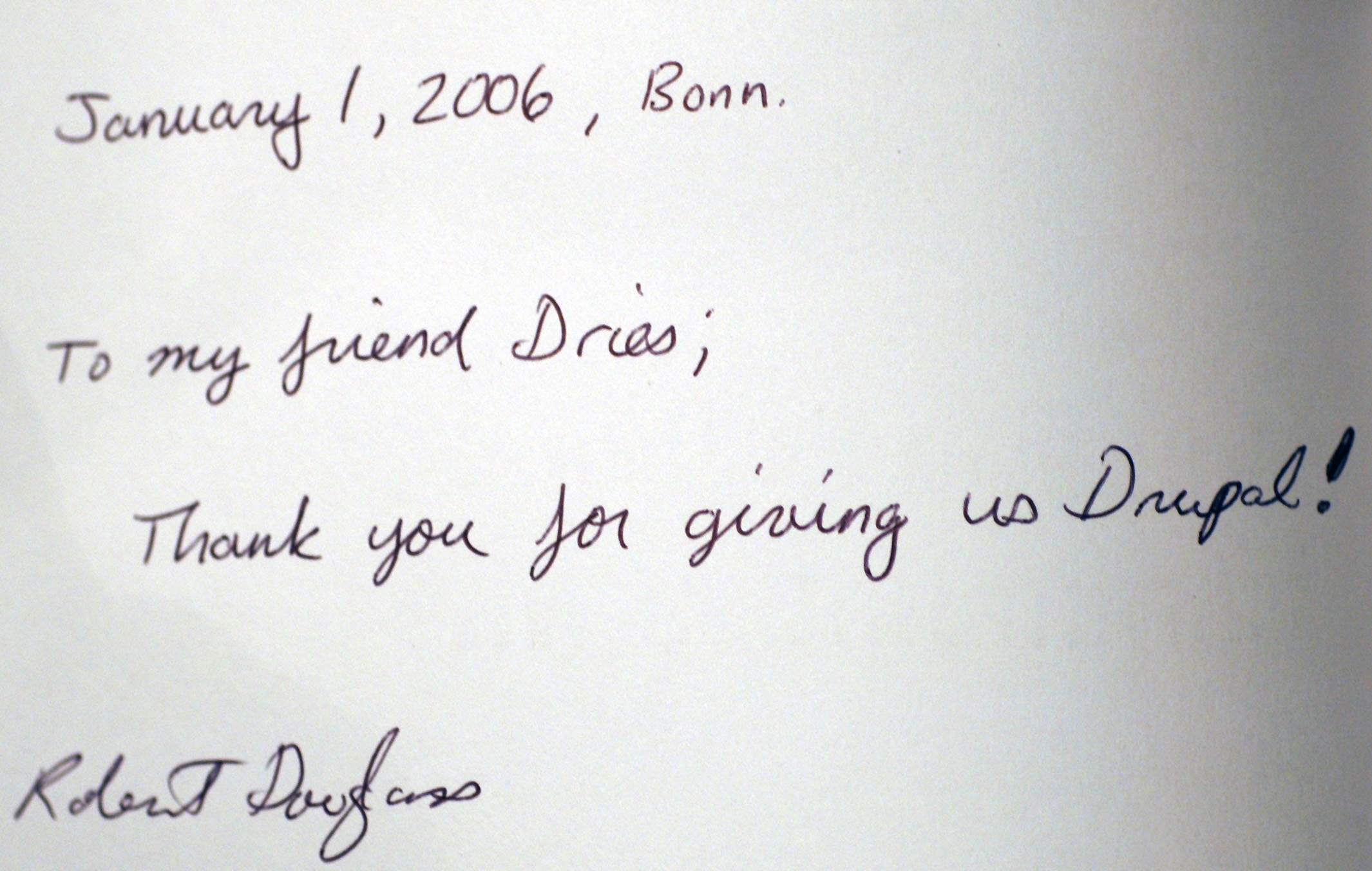 A handwritten note from Robert Douglass thanking Dries for creating Drupal, dated January 1, 2006, in Bonn.