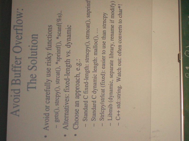 A presentation slide titled "Avoid Buffer Overflow: The Solution" lists strategies to prevent buffer overflow in programming.