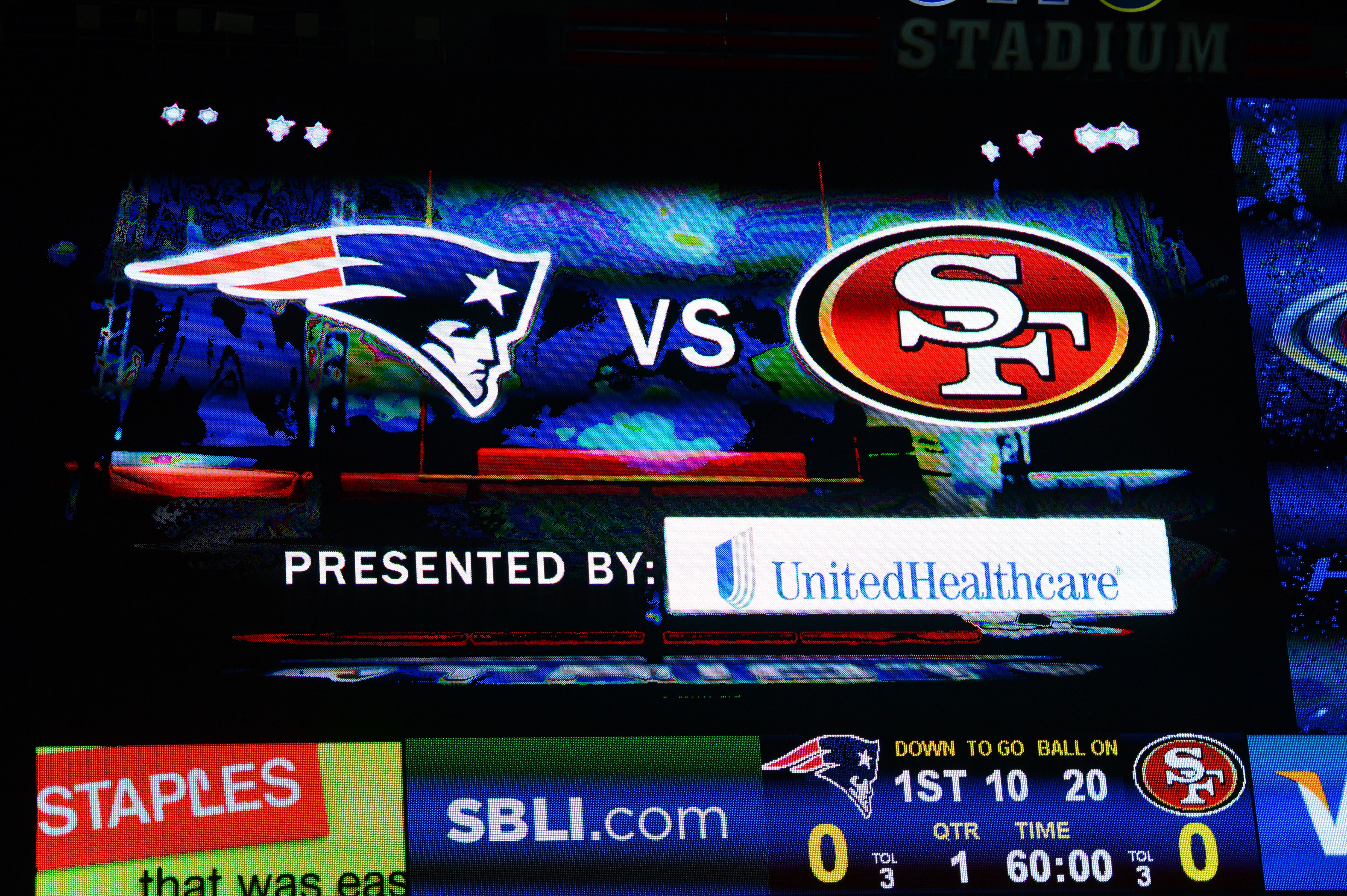 Scoreboard showing New England Patriots vs.