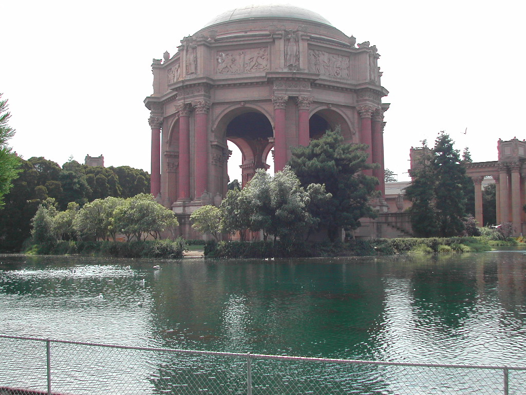 The Palace of Fine Arts in San Francisco, with a pond in the foreground and trees surrounding the structure.