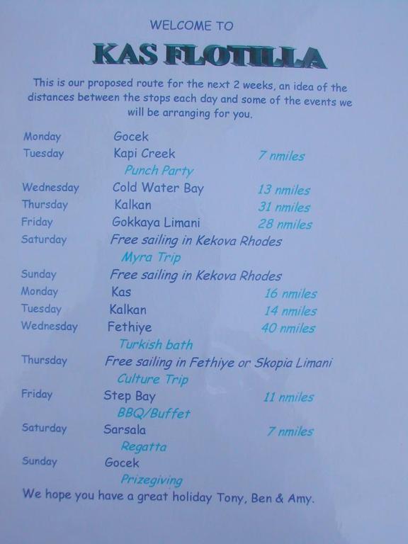 A printed itinerary for a two-week sailing route in Turkey, listing destinations, distances, and planned activities.
