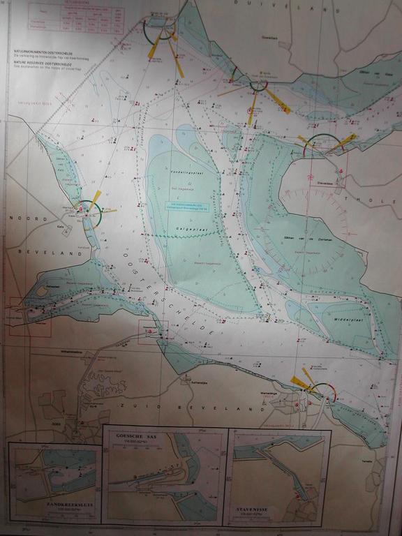 A nautical map showing waterways, depth markings, and navigation routes around Wemeldingen, with inset maps of specific areas.